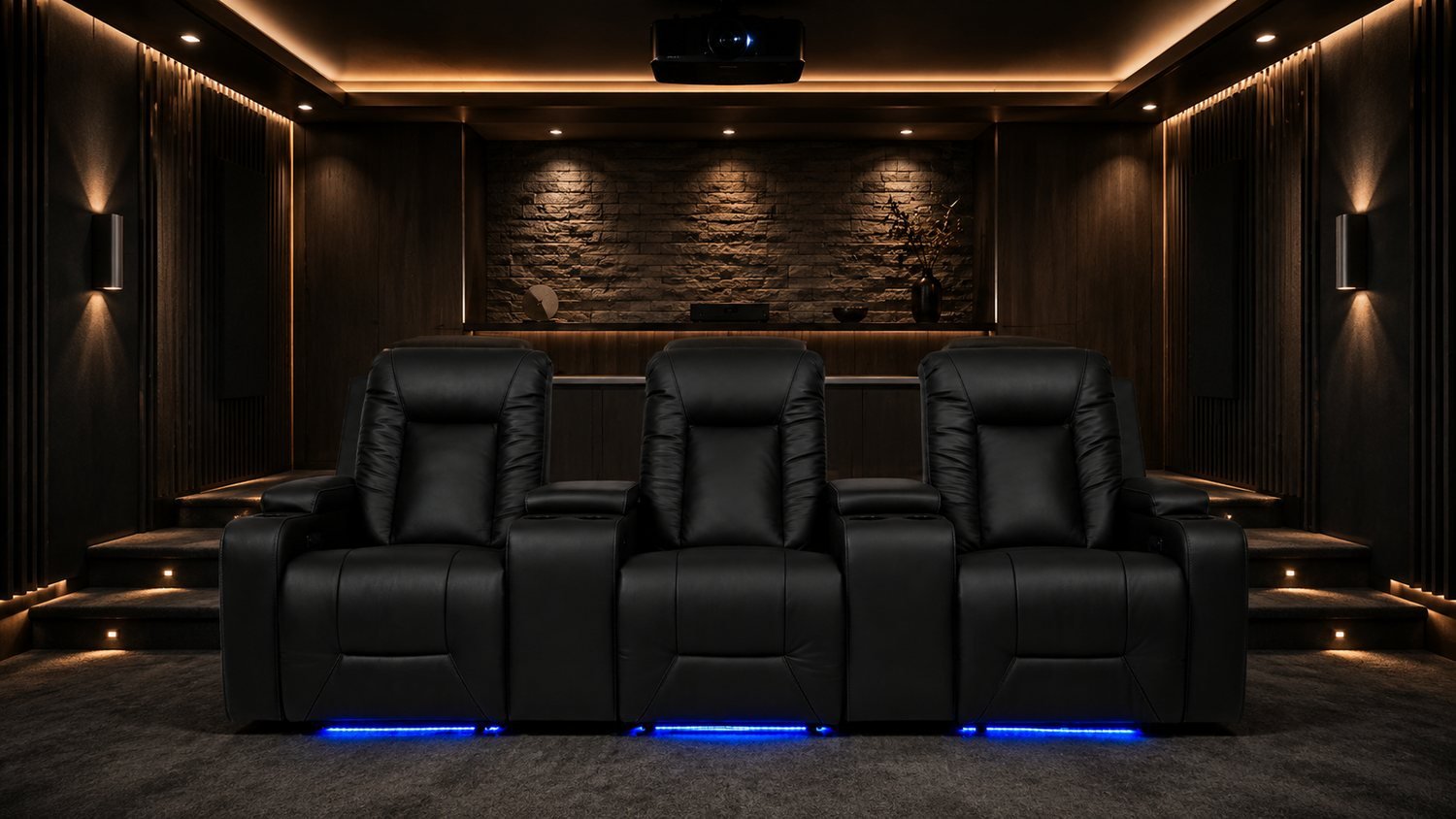 Fauteuils LumeO Azul en cuir noir installés dans une salle home cinéma habillée de brique, éclairage LED bleu