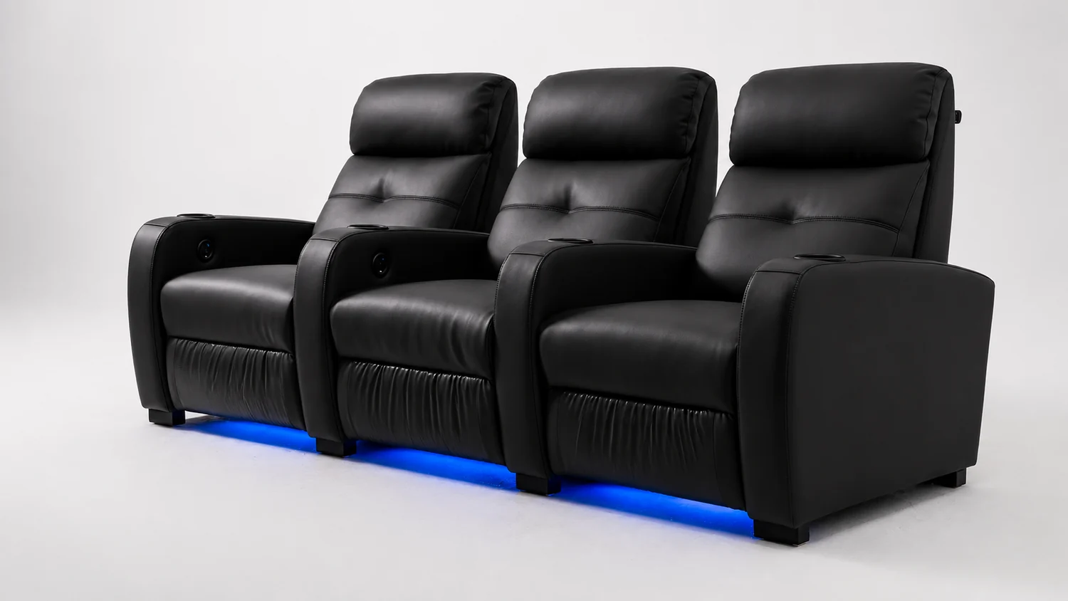 Rangée de fauteuils home cinéma LumeO Sava en cuir noir mat, éclairage LED bleu en base