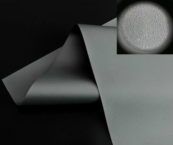 Grey ambient-light-rejecting (ALR) projection fabric, detail of the reflective surface